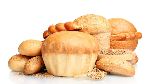 Delicious round bread, buns and wheat isolated on white — Stock Photo, Image