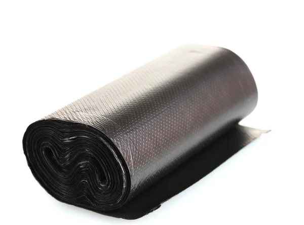 Roll of black garbage bags isolated on white — Stock Photo, Image