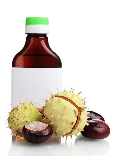 Green and brown chestnuts and medical bottle isolated on white — Stock Photo, Image