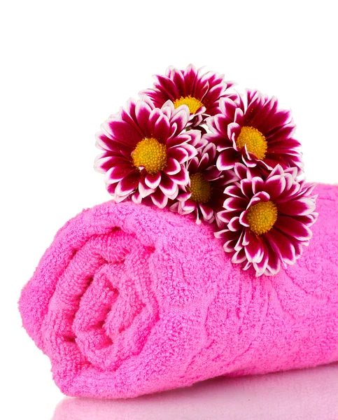 Pink towel and beautiful flowers isolated on white — Stock Photo, Image