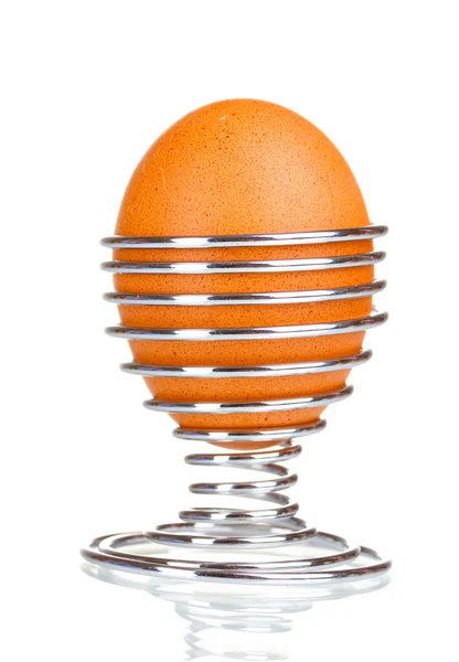 Boiled egg in metal stand isolated on white — Stock Photo, Image