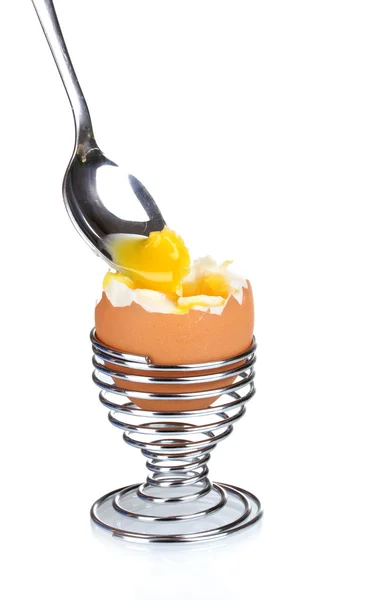 Boiled egg in metal stand and spoon isolated on white — Stock Photo, Image