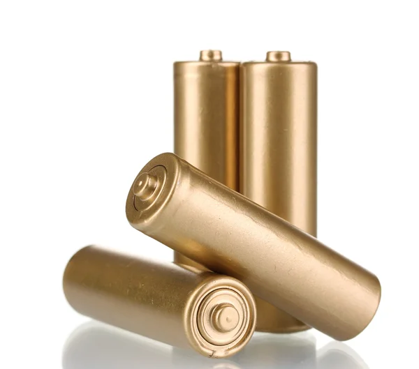 Čtyři zlaté baterie izolovaných na bílém — Stock fotografie