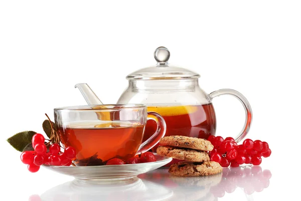 stock image Glass teapot and cup with black viburnum hips tea isolated on white