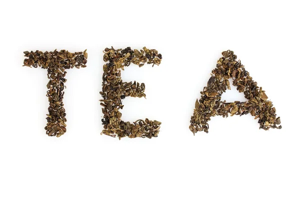 Λέξη τσάι από τα ξηρά φύλλα που απομονώνονται σε λευκό — Φωτογραφία Αρχείου