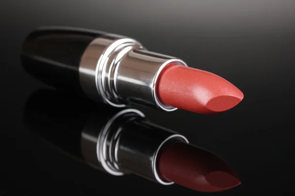 Beautiful lipstick on gray background — Stock Photo, Image