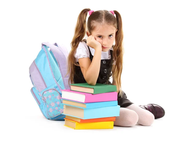 Beautiful little girl, books and a backpack isolated on white Stock Image