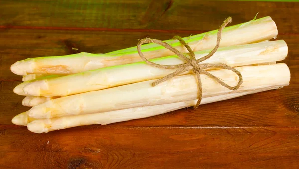 Beautiful white asparagus on wooden table Stock Photo