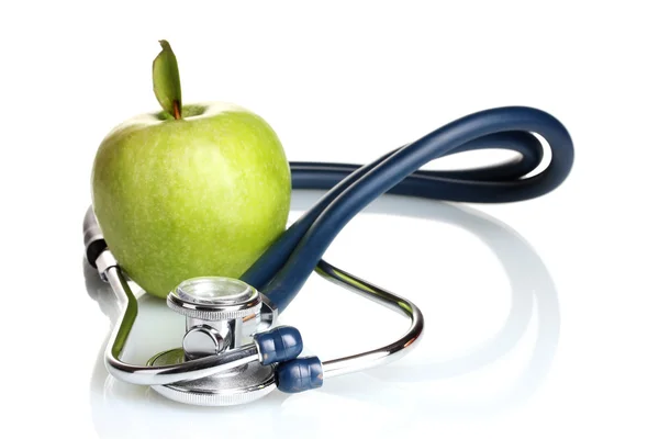 Medizinisches Stethoskop und grüner Apfel isoliert auf weiß Stockbild