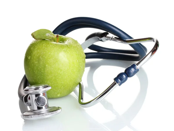Estetoscopio médico y manzana verde aislados en blanco Imagen de stock
