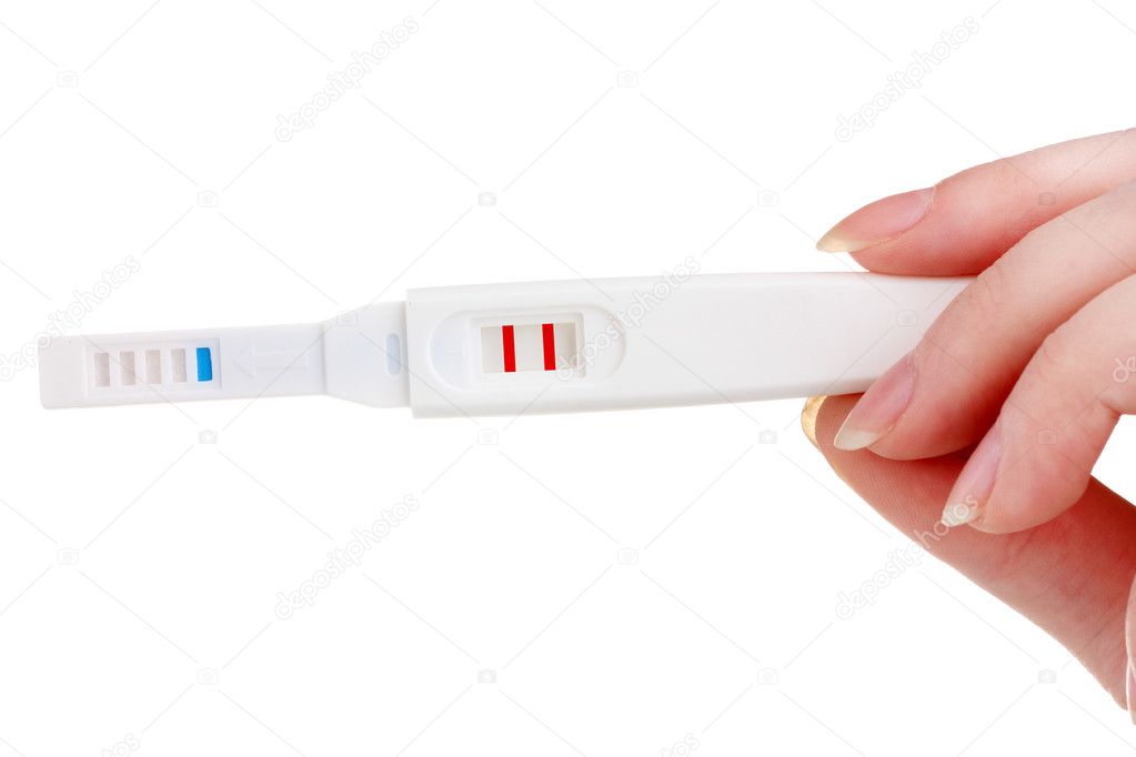 Pregnancy test in hand isolated on white