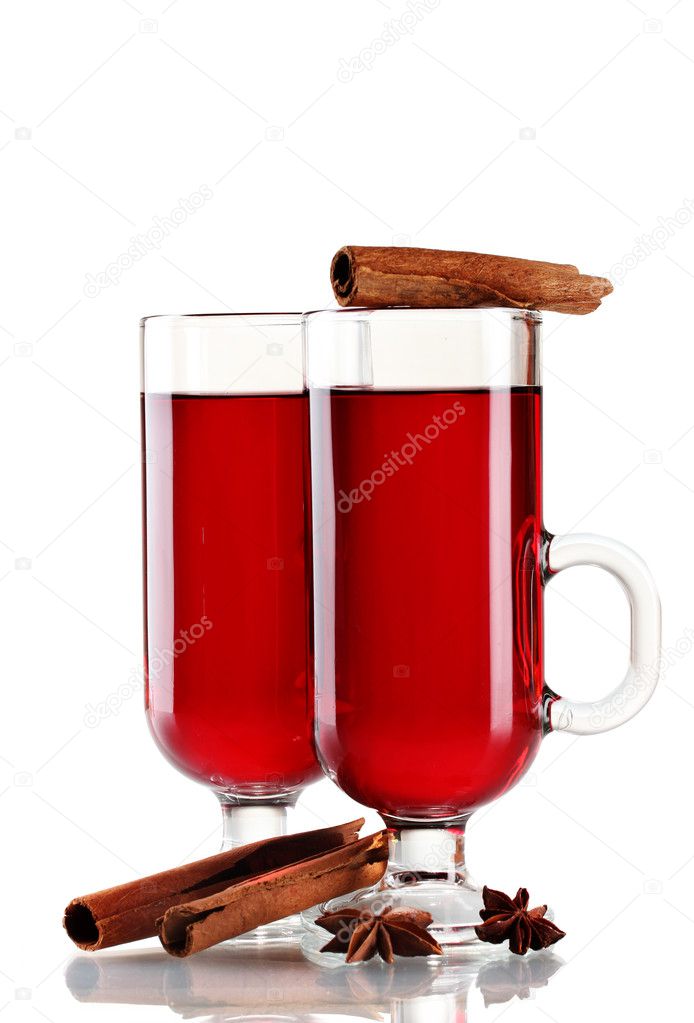 Mulled wine in the glasses, cinnamon and anise isolated on white