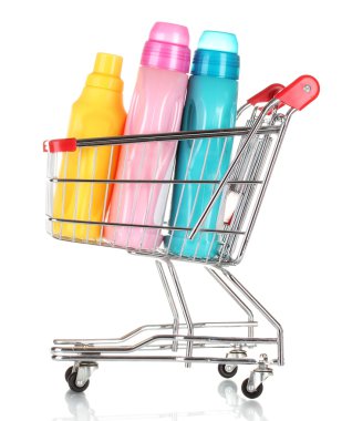 Shopping cart and detergent isolated on white clipart