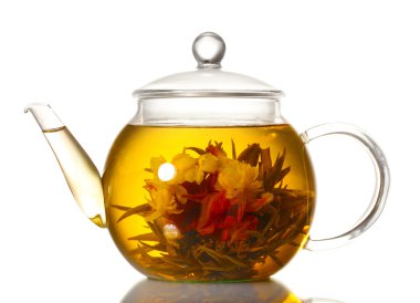 Exotic green tea with flowers in glass teapot isolated on white clipart