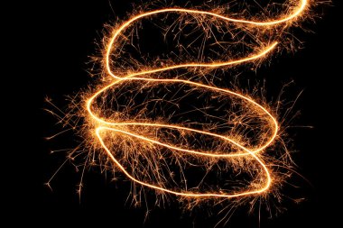 Beautiful sparkler on black background clipart