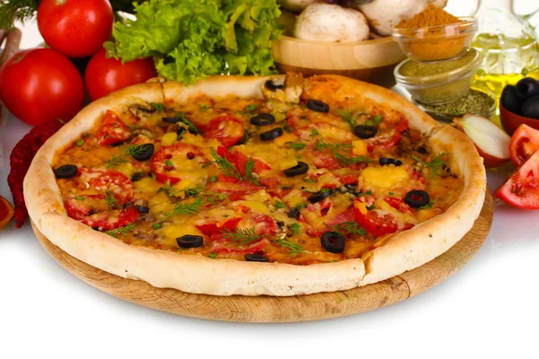 Delicious pizza on wooden board, vegetables, spices and oil isolated on whi — Stock Photo, Image