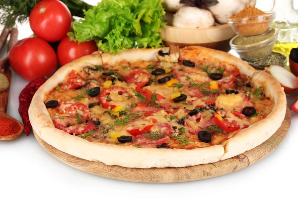 Delicious pizza on wooden board, vegetables, spices and oil isolated on whi — Stock Photo, Image