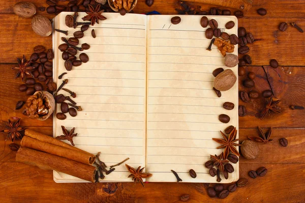 stock image Old paper for recipes and spices on wooden table