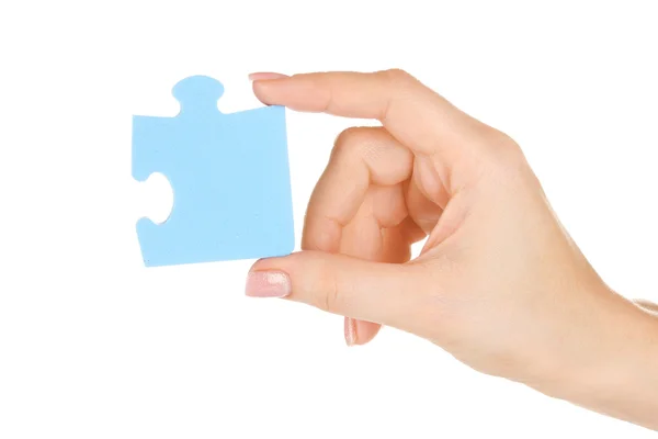 Modrý puzzle s rukou izolované na bílém — Stock fotografie
