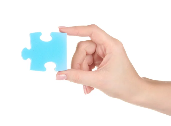 Blaues Puzzle mit einer Hand isoliert auf weißem Hintergrund — Stockfoto