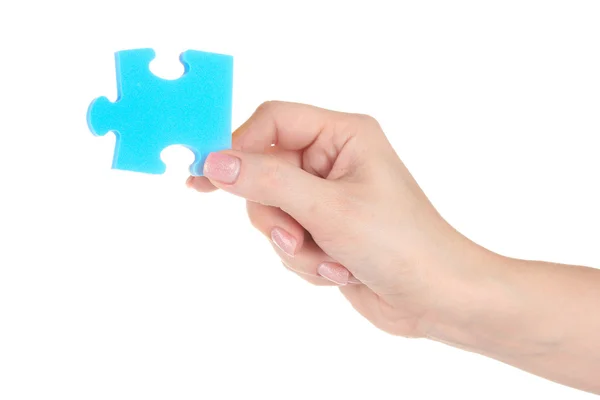 Puzzle blu con una mano isolata su bianco — Foto Stock