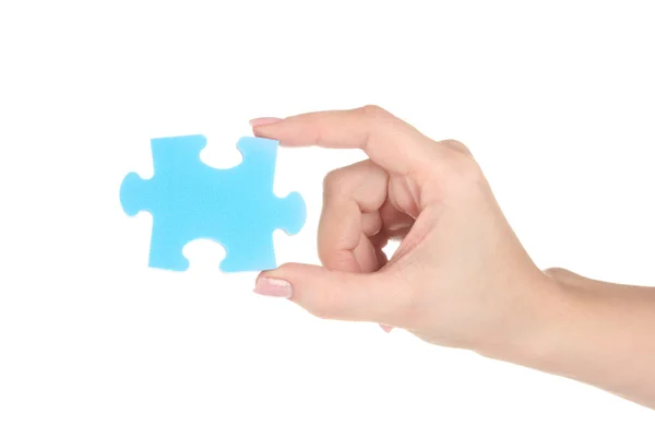 Blaues Puzzle mit einer Hand isoliert auf weißem Hintergrund — Stockfoto