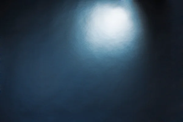 Spotlight-studio interieur, blauwe achtergrond — Stockfoto