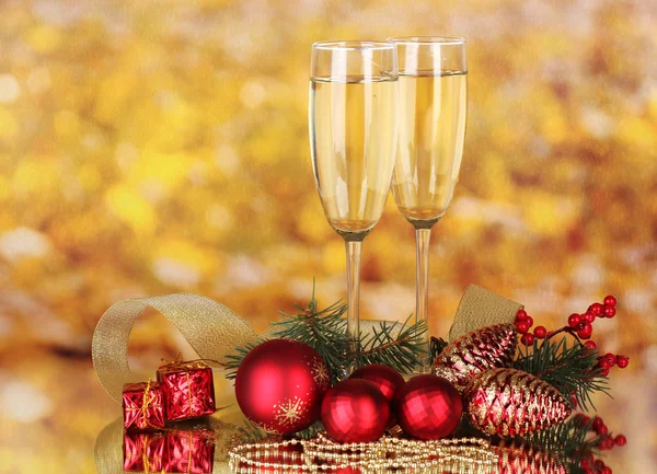 Two glasses with christmas decoration on yellow — Stock Photo, Image