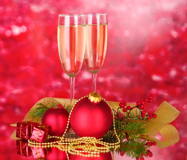 Two glasses with christmas decoration on red — Stock Photo, Image