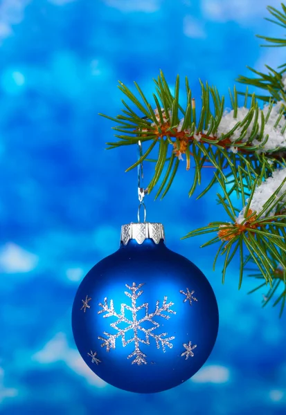 Christmas ball on the tree on blue — Stock Photo, Image