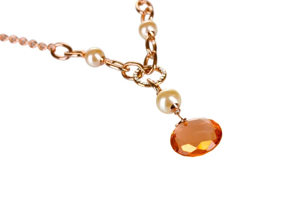Pendant with an orange gem isolated on white — Stock Photo, Image