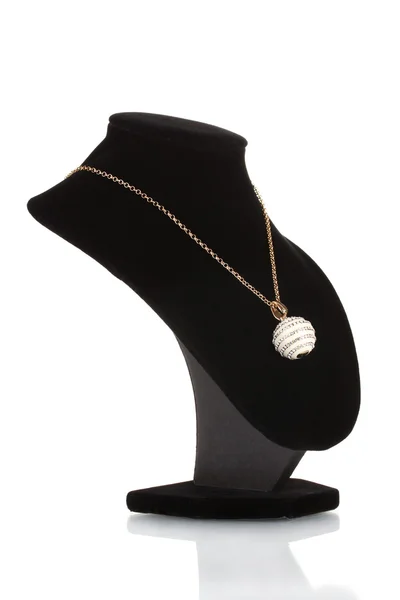Pendant in form of ball with gem on mannequin isolated on white — 图库照片