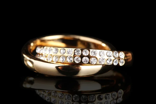 Golden ring on black background — Stock Photo, Image