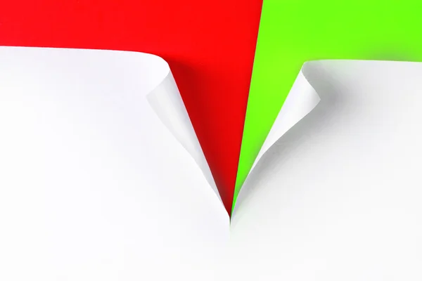 Zerrissenes Papier mit rotem und grünem Hintergrund — Stockfoto