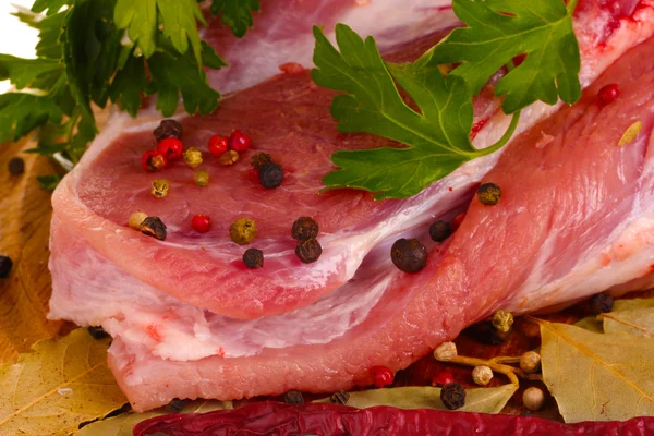 stock image Raw meat and vegetables on a wooden board closeup