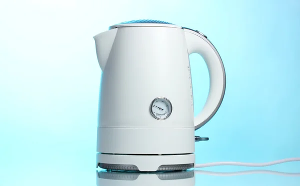 White electric kettle on blue — Stock Photo, Image