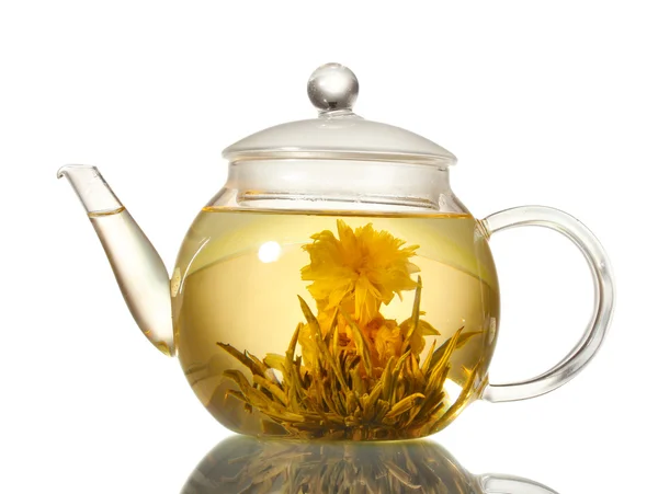 Exotic green tea with flowers in glass teapot isolated on white — Stock Photo, Image