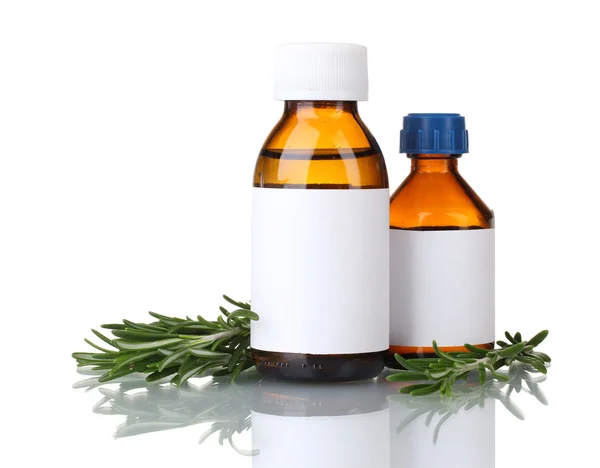 Medizinische Flaschen und frischer grüner Rosmarin isoliert auf weiß — Stockfoto