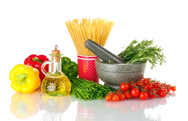 Spaghetti in cup, rosemary in mortar, oil in jar paprika, tomatoes cherry, — Stock Photo, Image