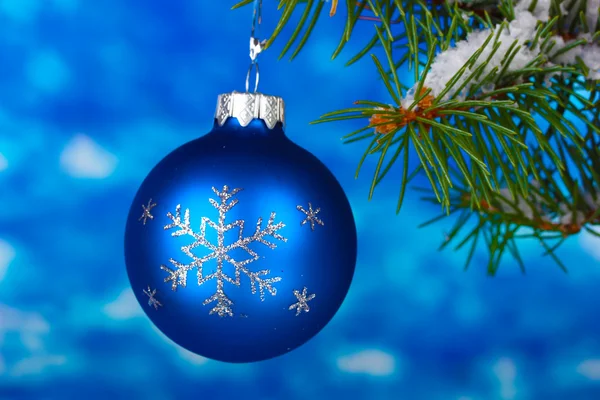Christmas ball on the tree on blue Stock Photo