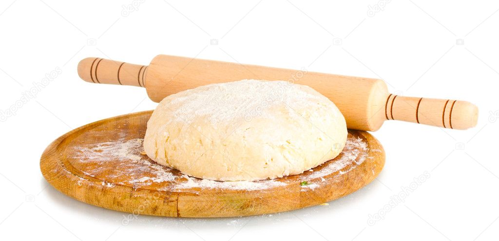 Dough on wooden board isolated on white