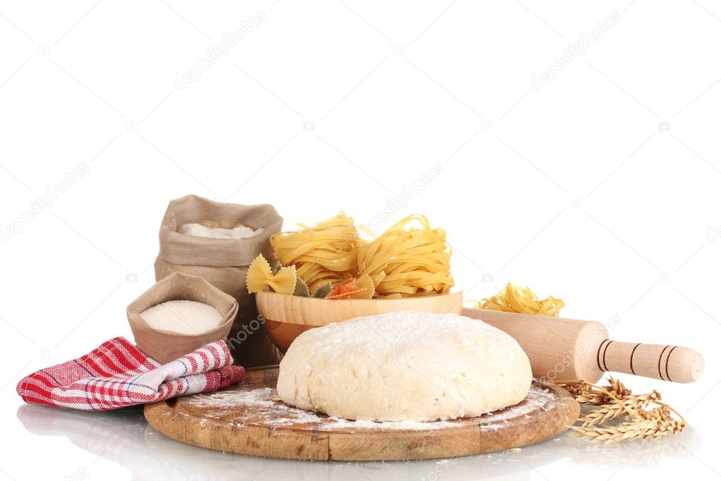 Ingredients for homemade pasta on wooden plate isolated on white