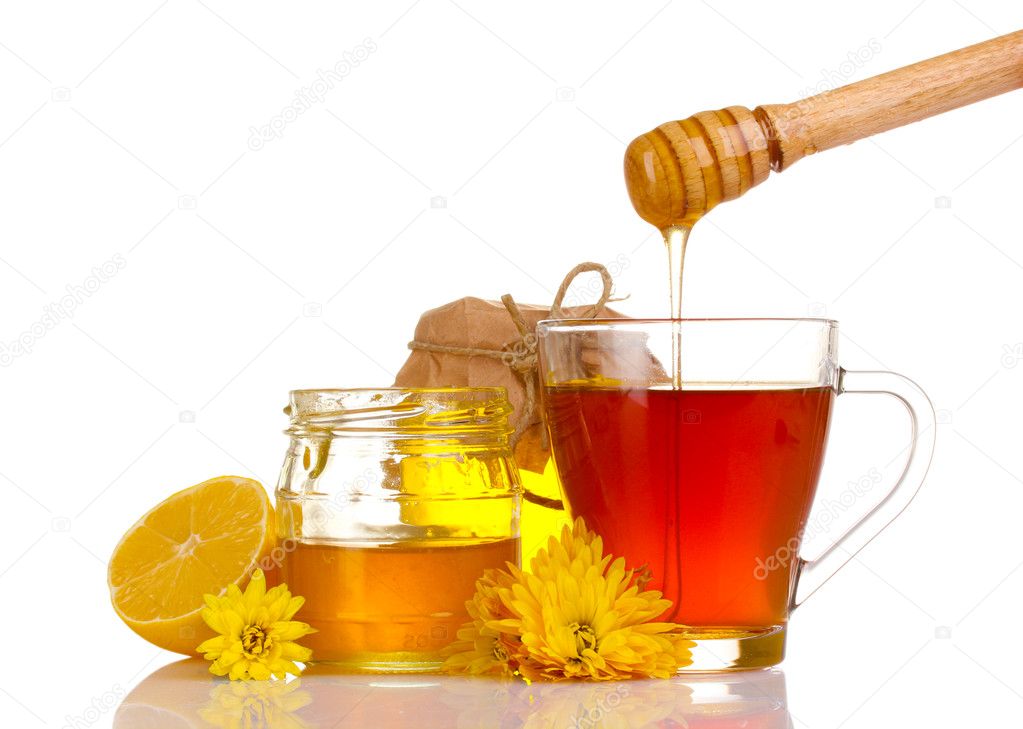 Honey, lemon and a cup of tea isolated on white