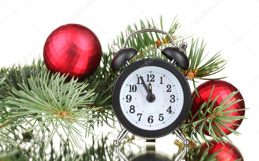 Green Christmas tree with toy and clock isolated on white