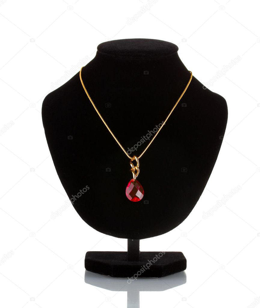 Pendant with red gem on mannequin isolated on white