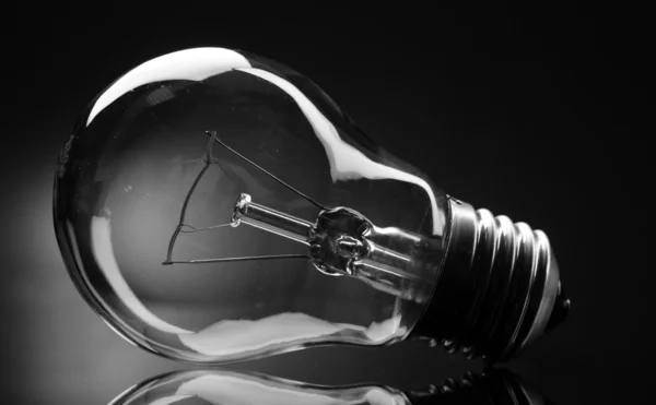 Light bulb on black background — Stock Photo, Image