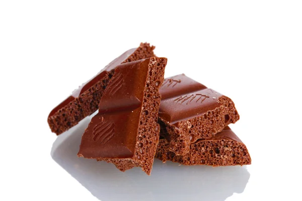 Slices of milk chocolate bar isolated on white — Stock Photo, Image