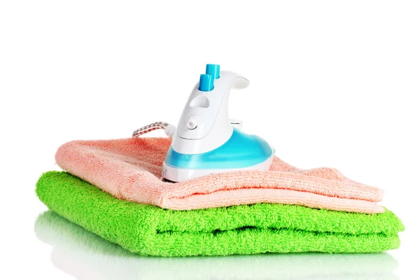 Two towels and iron isolated on white — Stock Photo, Image