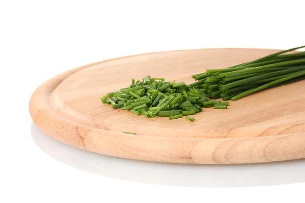 Beautiful green onion chives on wooden board isolated on white — Stock Photo, Image