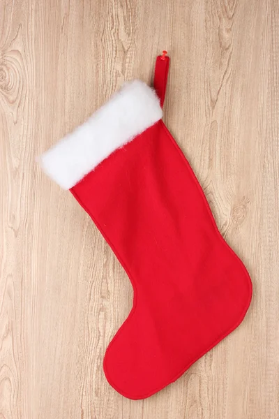 stock image Christmas sock on wooden background